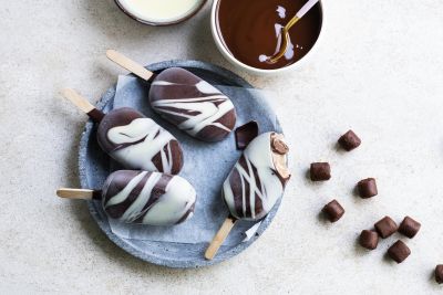 Cookie dough ice cream sticks with cocoa marbled chocolate coating