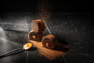 Chocolate cake rolls dusted with cocoa powder
