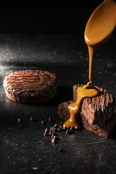 Healthy cake with caramel pour, dramatic lighting