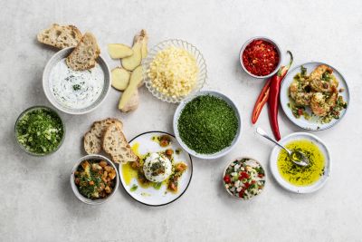 Herbs and dips ingredients spread with fresh bread