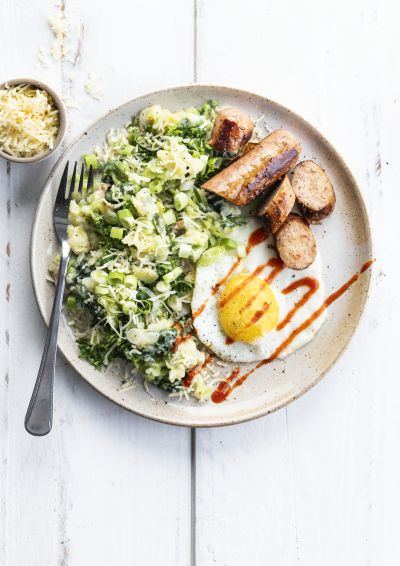 Savoy cabbage and potato hash with fried egg and Green Way veggie sausage