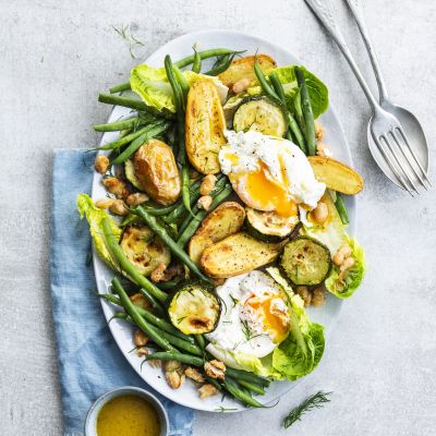 Poached eggs with baby potatoes, green beans and courgette