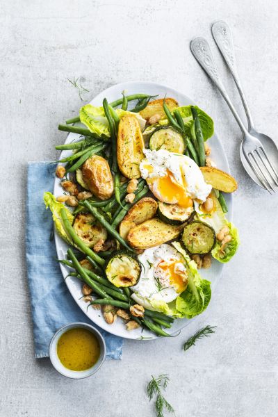 Poached eggs with baby potatoes, green beans and courgette