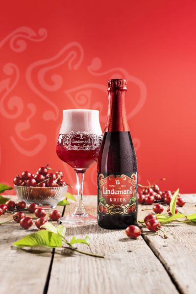 Lindemans Kriek 35cl beer bottle and glass with fresh cherries
