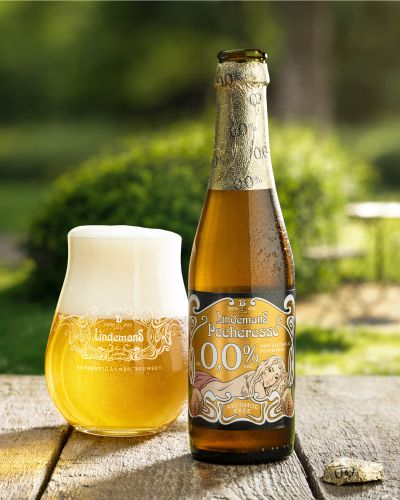 Pecheresse Bottle Next To Filled Tumbler Glass Open Bottle 4x5 &mdash; Lindemans campaign photography by Foodphoto