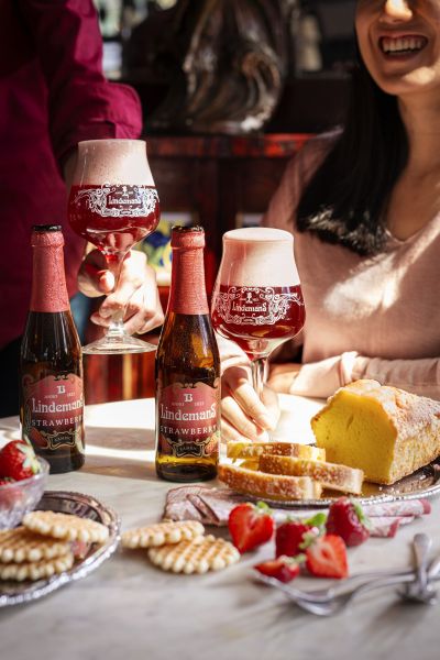 Lindemans strawberry beer served bistro-style with cheese and bread