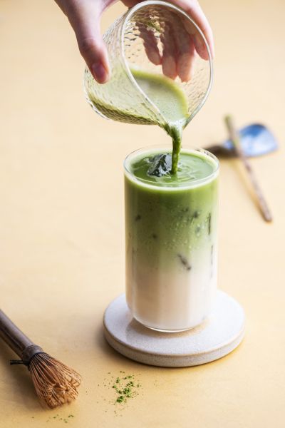 Alpro Barista iced matcha latte being poured