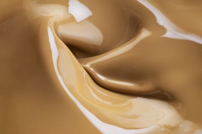Swirling coffee caramel meal-to-go drink texture, close-up