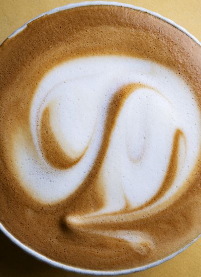 Latte art in Alpro Barista oat milk foam, close-up