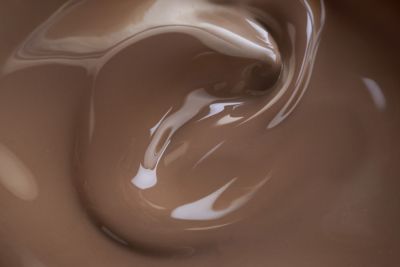 Swirling chocolate banana meal-to-go drink texture, close-up