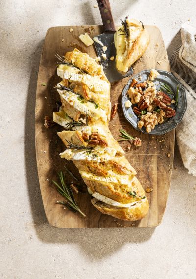 Rustic half baguette with melted camembert