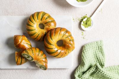 Matcha brioche pastries dusted with matcha powder